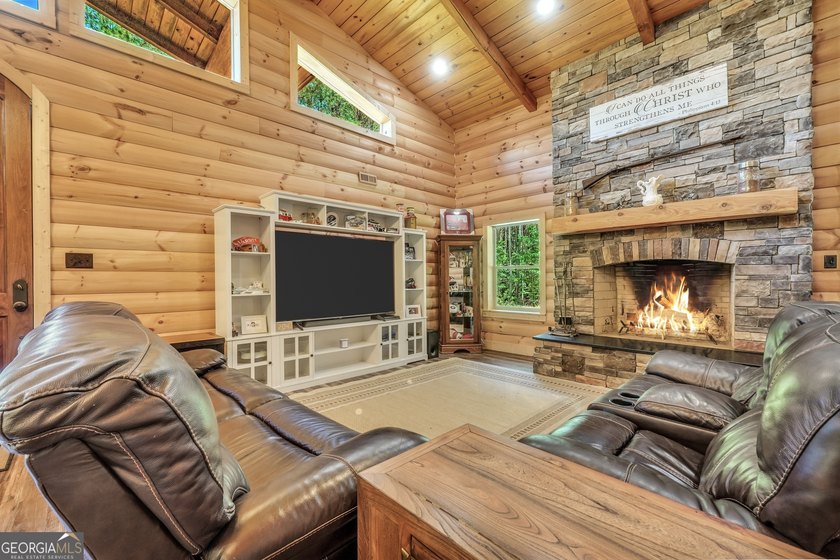 Beautifully custom-built log cabin style home privately situated - photo 17