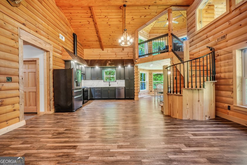 Beautifully custom-built log cabin style home privately situated - photo 19