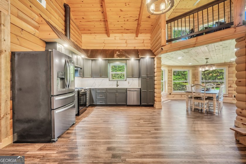 Beautifully custom-built log cabin style home privately situated - photo 23