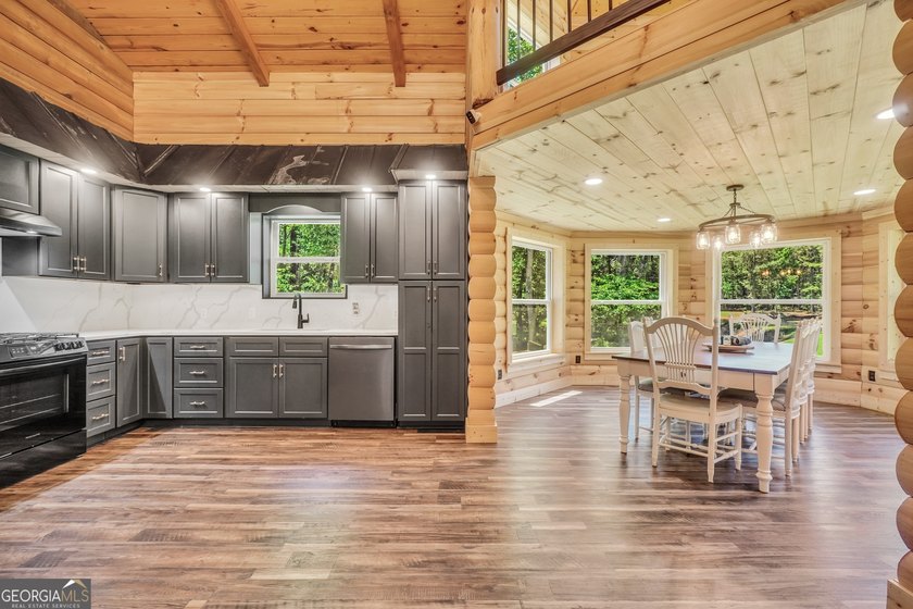 Beautifully custom-built log cabin style home privately situated - photo 25