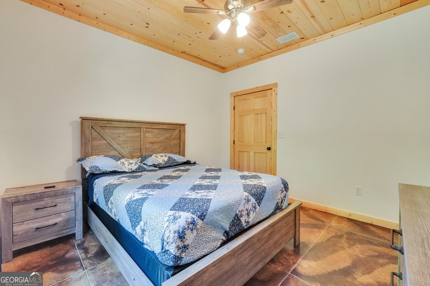 Beautifully custom-built log cabin style home privately situated - photo 31