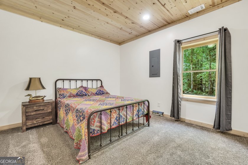 Beautifully custom-built log cabin style home privately situated - photo 35