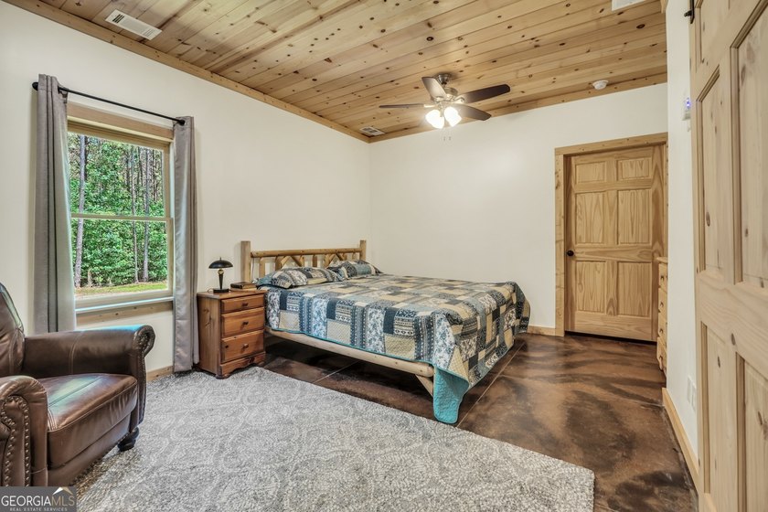 Beautifully custom-built log cabin style home privately situated - photo 39