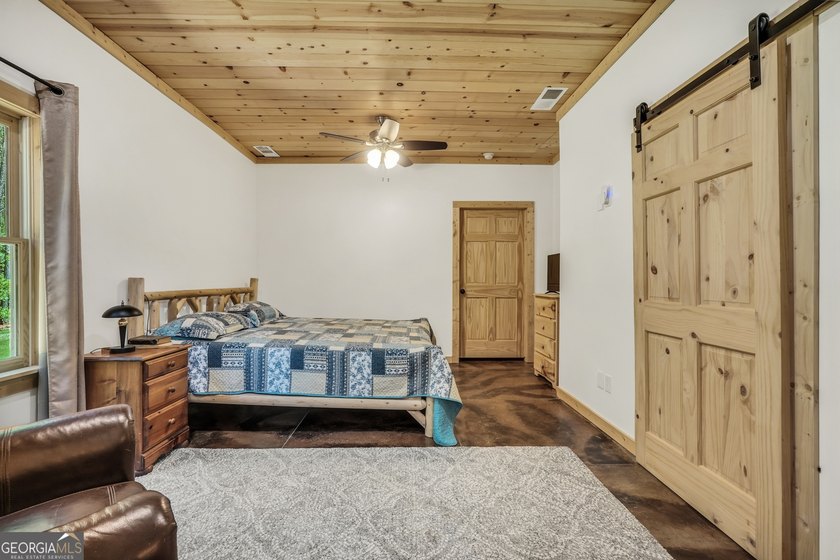 Beautifully custom-built log cabin style home privately situated - photo 40
