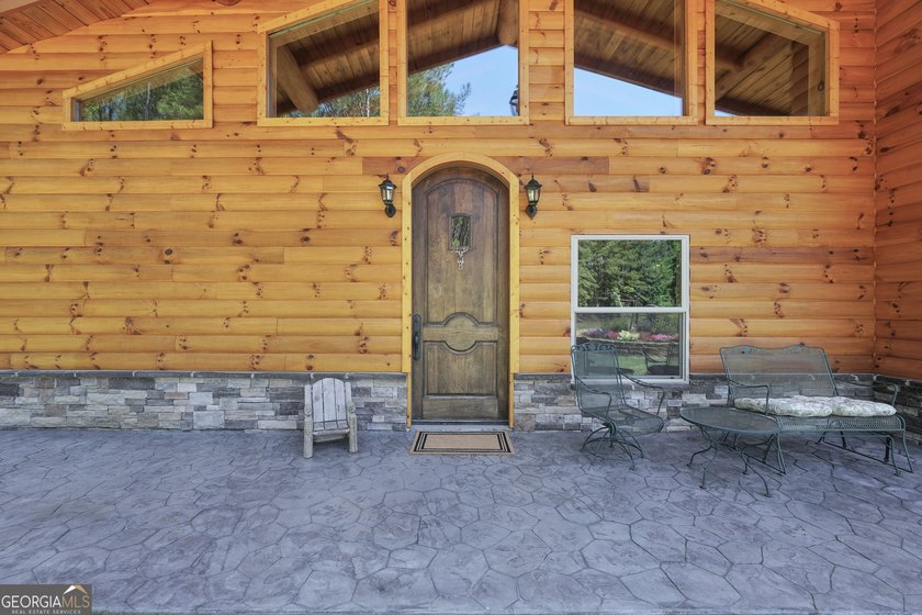 Beautifully custom-built log cabin style home privately situated - photo 45
