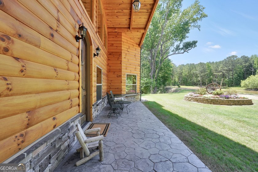 Beautifully custom-built log cabin style home privately situated - photo 46