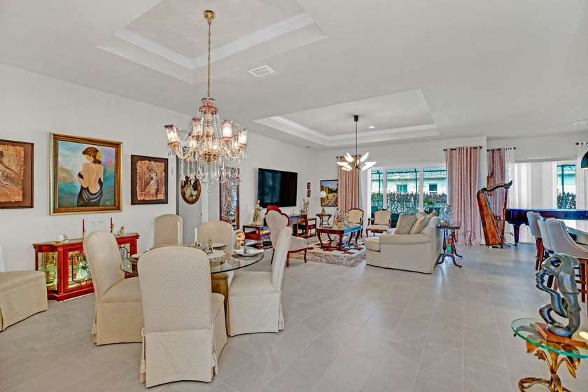 This stunning corner-lot home offers breathtaking lake views and - photo 2