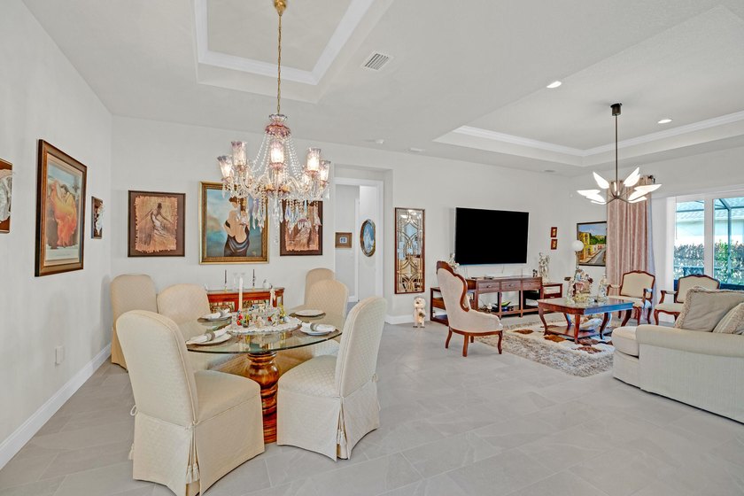 This stunning corner-lot home offers breathtaking lake views and - photo 3