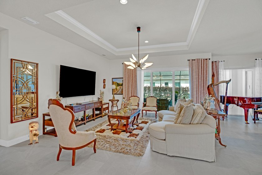 This stunning corner-lot home offers breathtaking lake views and - photo 4
