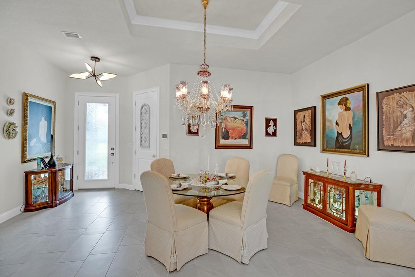 This stunning corner-lot home offers breathtaking lake views and - photo 7
