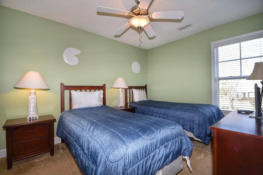 Experience coastal living in this bright and fully furnished - photo 12