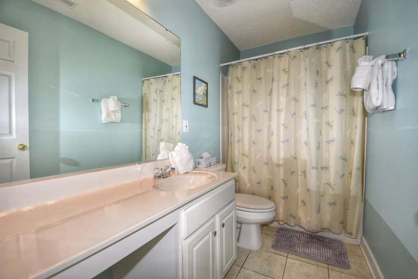 Experience coastal living in this bright and fully furnished - photo 13