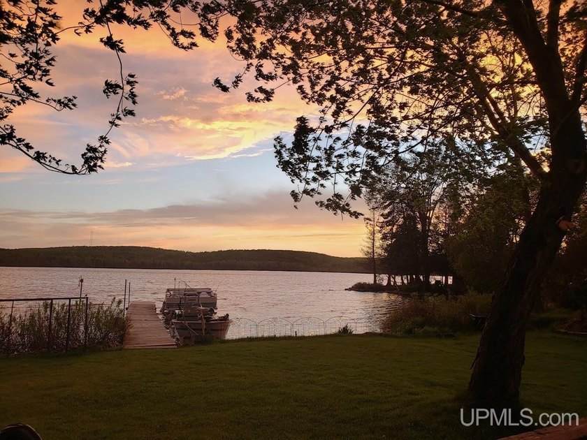 Experience true Northwoods living with this charming waterfront - photo 34