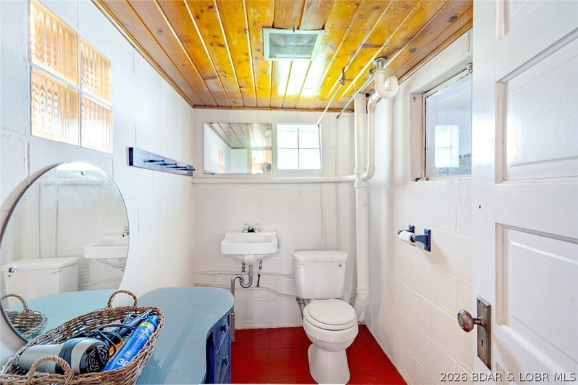 Originally a Quonset hut, this unique lakefront property blends - photo 25