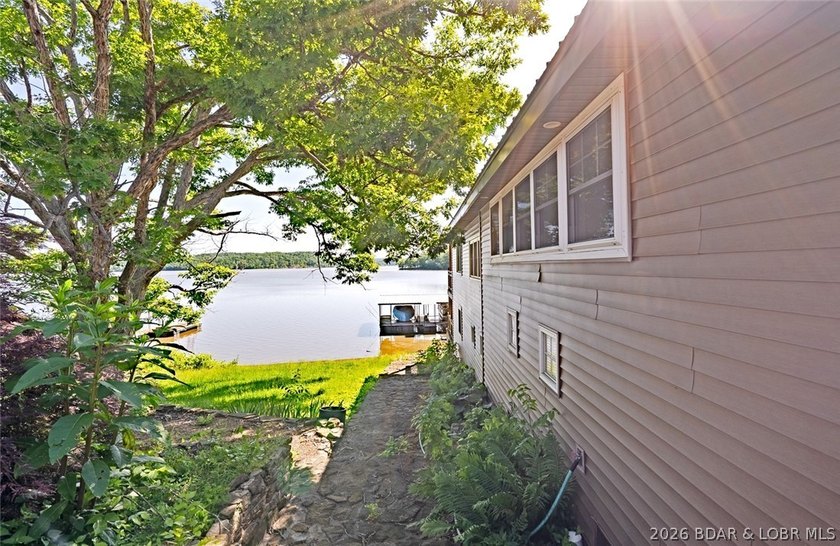 Originally a Quonset hut, this unique lakefront property blends - photo 35