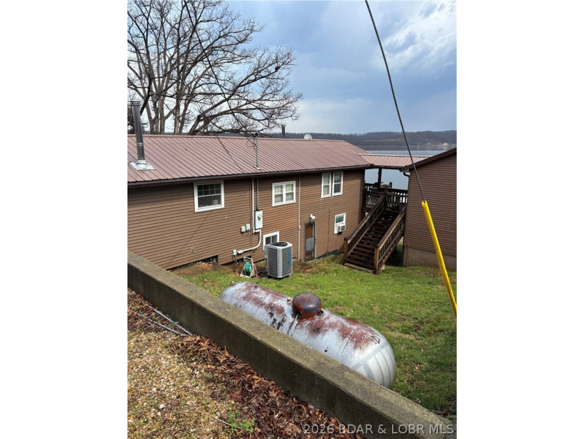 Originally a Quonset hut, this unique lakefront property blends - photo 37