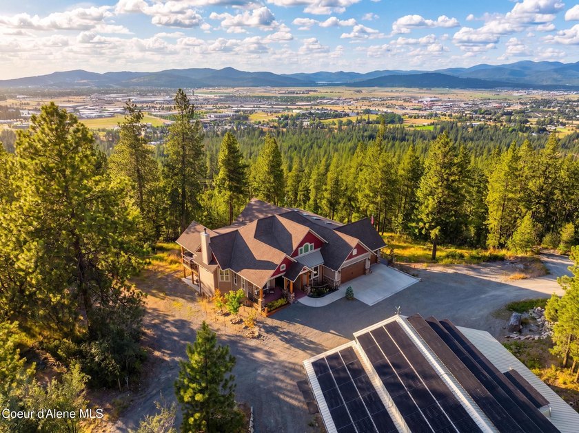 Stunning sunsets frame this custom designed Craftsman that sits - photo 14