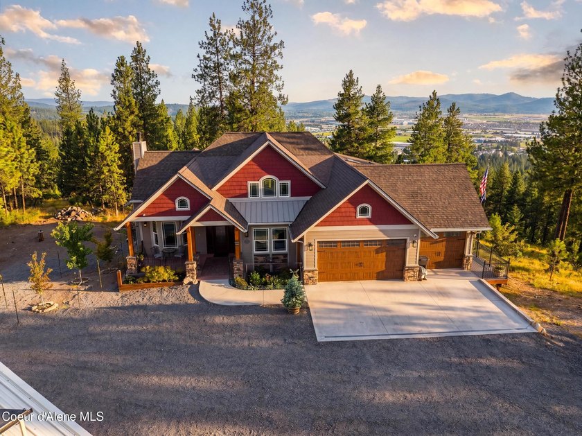 Stunning sunsets frame this custom designed Craftsman that sits - photo 15