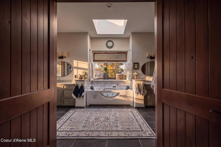 Stunning sunsets frame this custom designed Craftsman that sits - photo 24