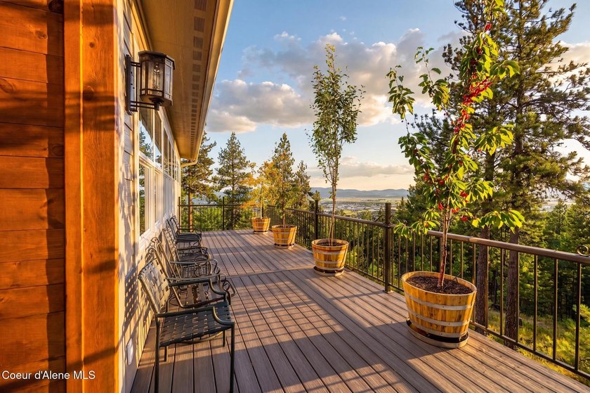 Stunning sunsets frame this custom designed Craftsman that sits - photo 35