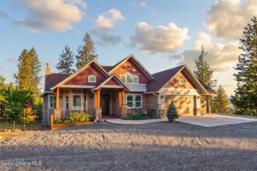 Stunning sunsets frame this custom designed Craftsman that sits - photo 36