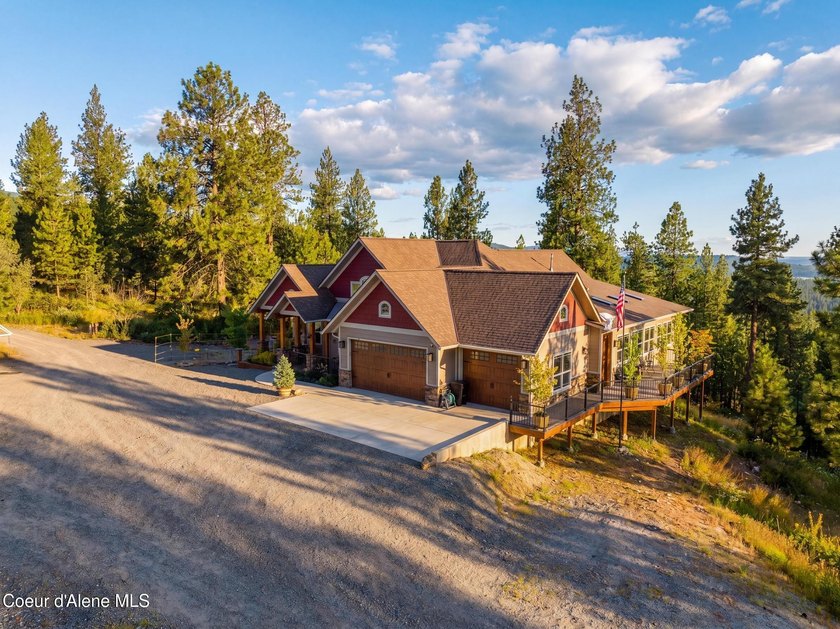 Stunning sunsets frame this custom designed Craftsman that sits - photo 38
