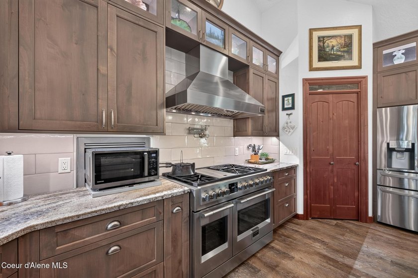 Stunning sunsets frame this custom designed Craftsman that sits - photo 50