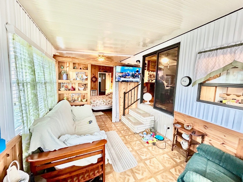 This mobile home is located in a peaceful 55+ community and - photo 2