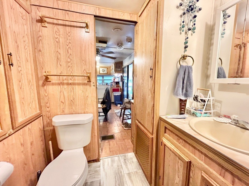 This mobile home is located in a peaceful 55+ community and - photo 8