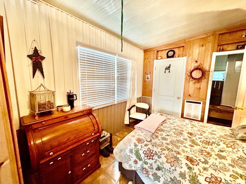 This mobile home is located in a peaceful 55+ community and - photo 9