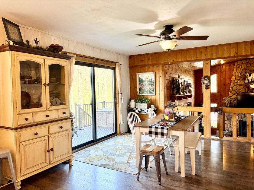 Set on a beautifully wooded 1.7-acre lot with 393 feet of sandy - photo 11