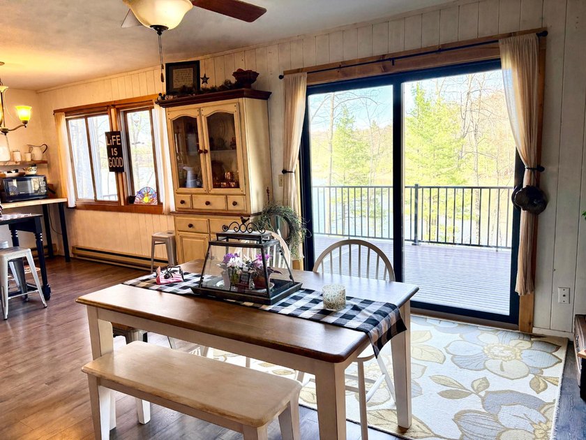 Set on a beautifully wooded 1.7-acre lot with 393 feet of sandy - photo 12