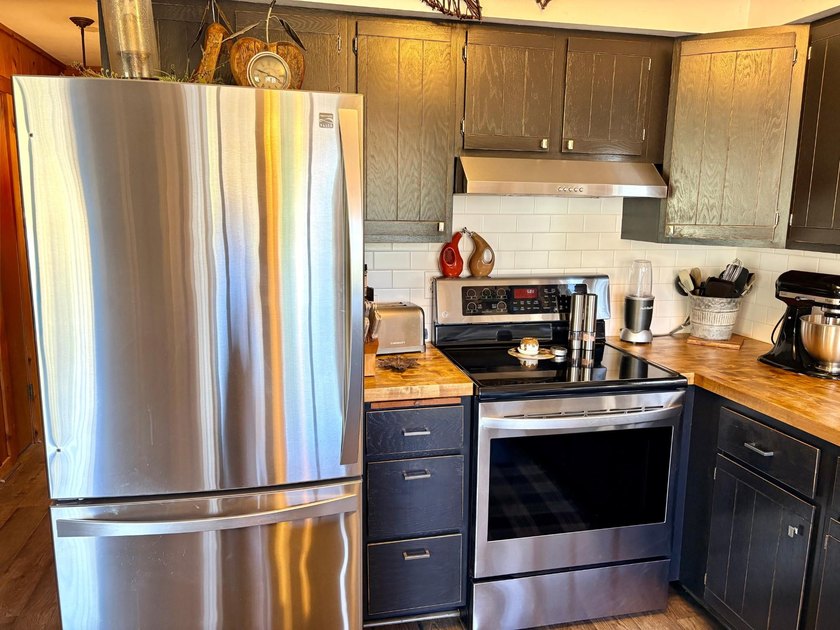 Set on a beautifully wooded 1.7-acre lot with 393 feet of sandy - photo 17