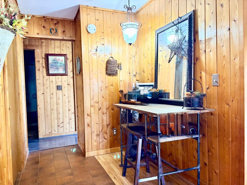 Set on a beautifully wooded 1.7-acre lot with 393 feet of sandy - photo 24