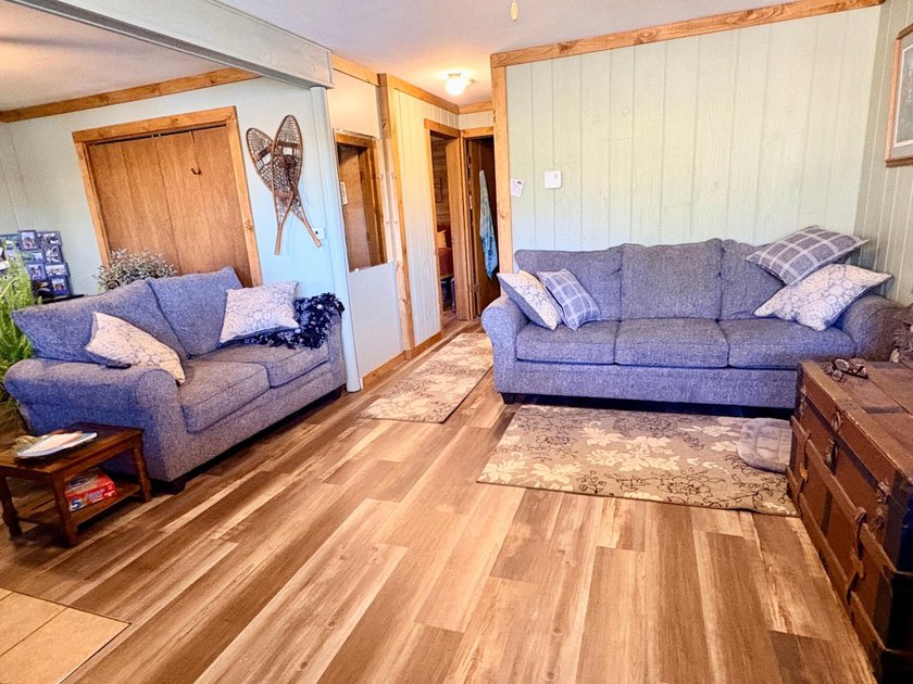 Set on a beautifully wooded 1.7-acre lot with 393 feet of sandy - photo 26