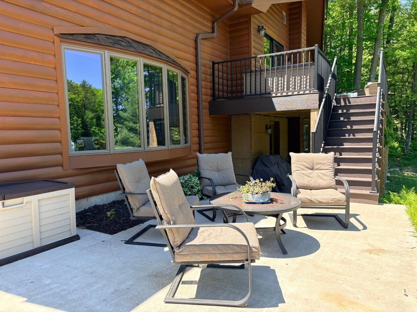 Set on a beautifully wooded 1.7-acre lot with 393 feet of sandy - photo 32