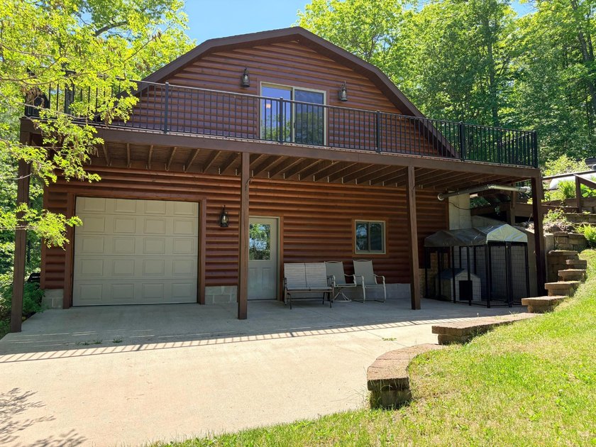 Set on a beautifully wooded 1.7-acre lot with 393 feet of sandy - photo 33