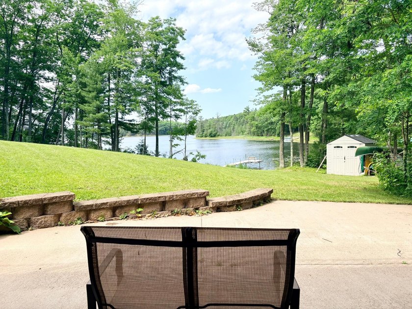 Set on a beautifully wooded 1.7-acre lot with 393 feet of sandy - photo 34