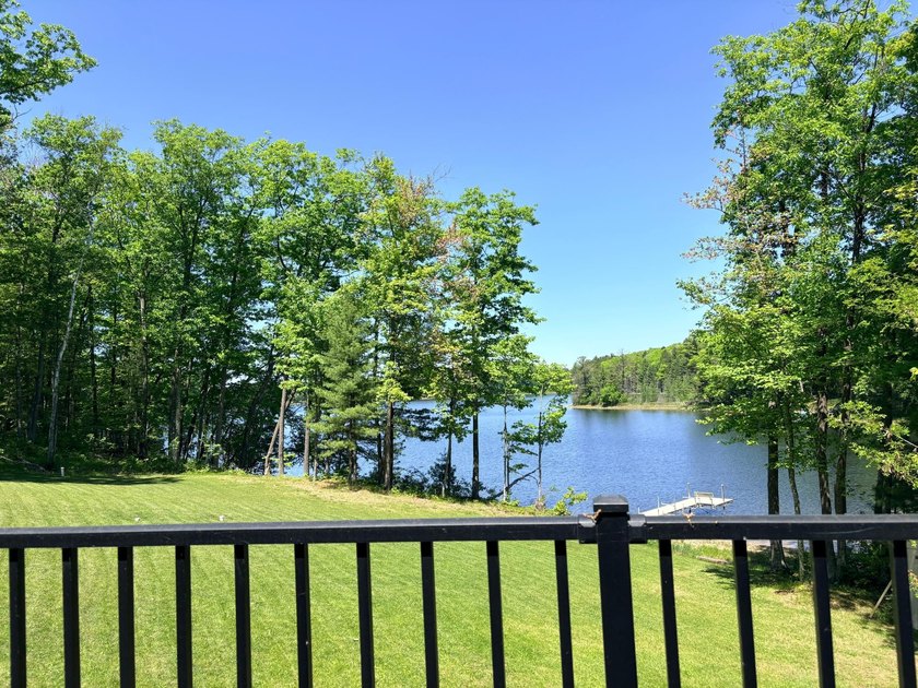 Set on a beautifully wooded 1.7-acre lot with 393 feet of sandy - photo 36