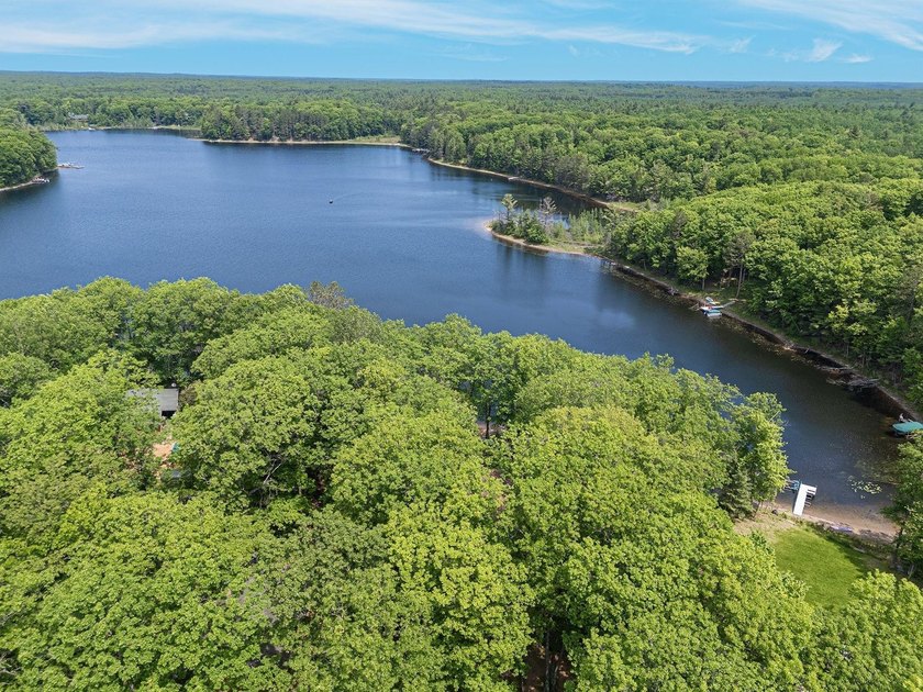 Set on a beautifully wooded 1.7-acre lot with 393 feet of sandy - photo 38
