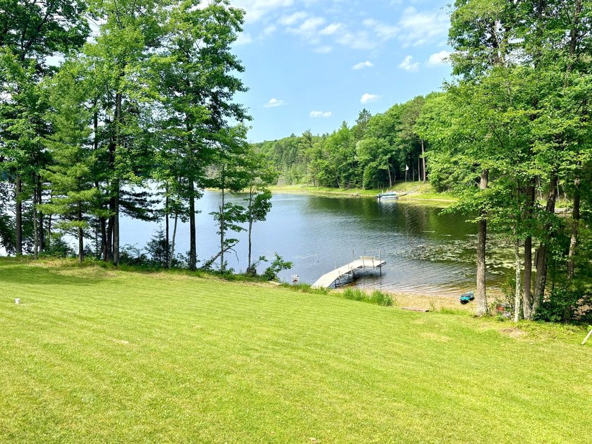 Set on a beautifully wooded 1.7-acre lot with 393 feet of sandy - photo 47