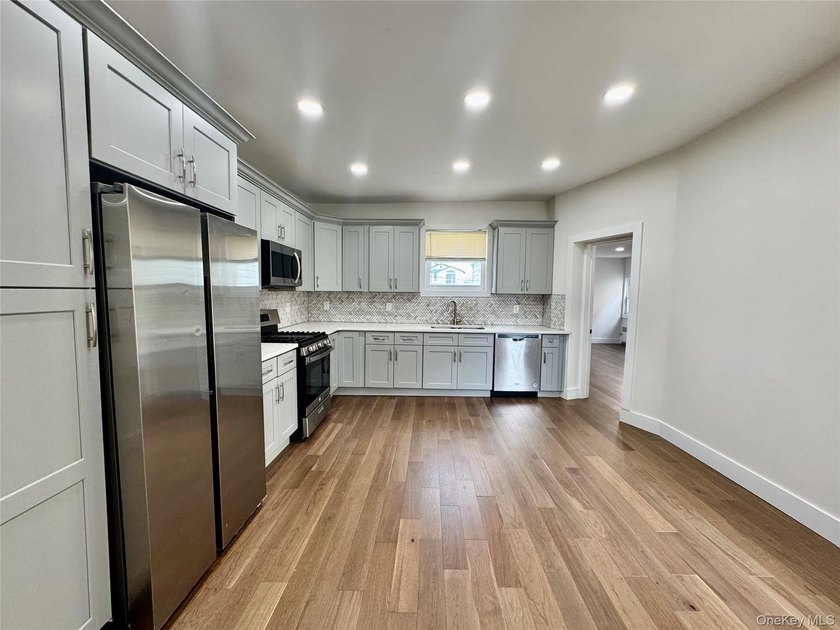 Welcome to this income-producing residential property in the - photo 6