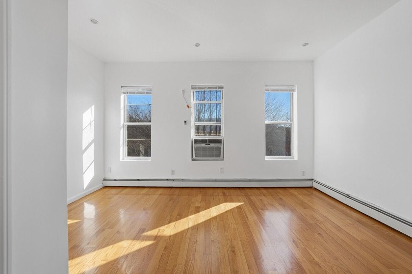 Move right into this lovely renovated two-family townhouse - photo 4