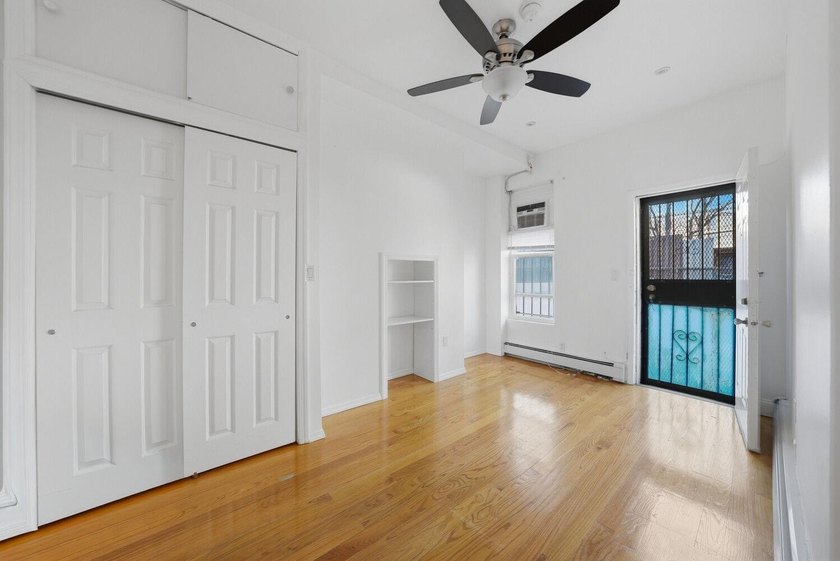 Move right into this lovely renovated two-family townhouse - photo 5