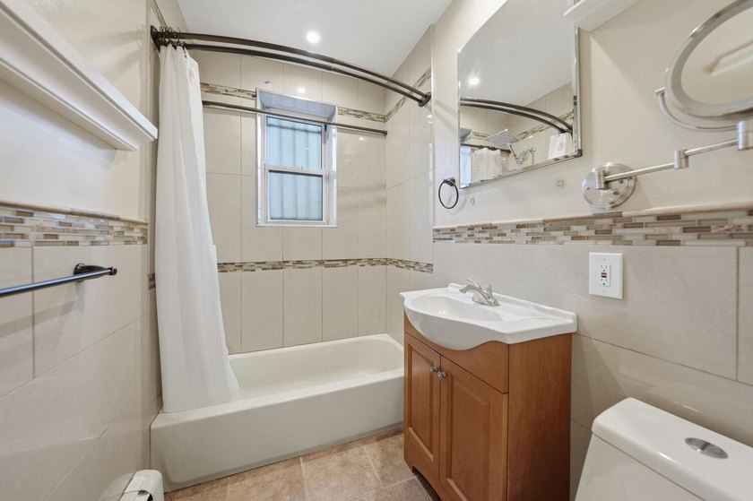 Move right into this lovely renovated two-family townhouse - photo 6