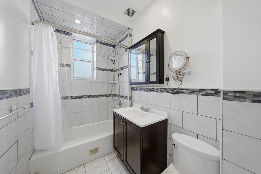 Move right into this lovely renovated two-family townhouse - photo 7