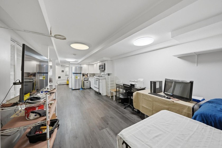 Move right into this lovely renovated two-family townhouse - photo 10