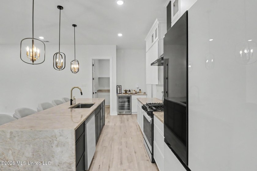 Welcome to this stunning custom-built 2025 home, where modern - photo 12