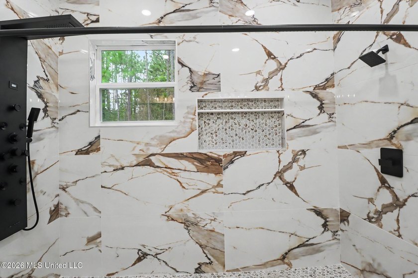 Welcome to this stunning custom-built 2025 home, where modern - photo 19