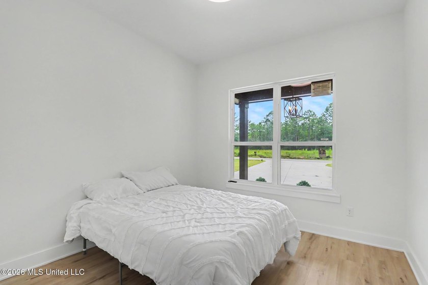 Welcome to this stunning custom-built 2025 home, where modern - photo 25